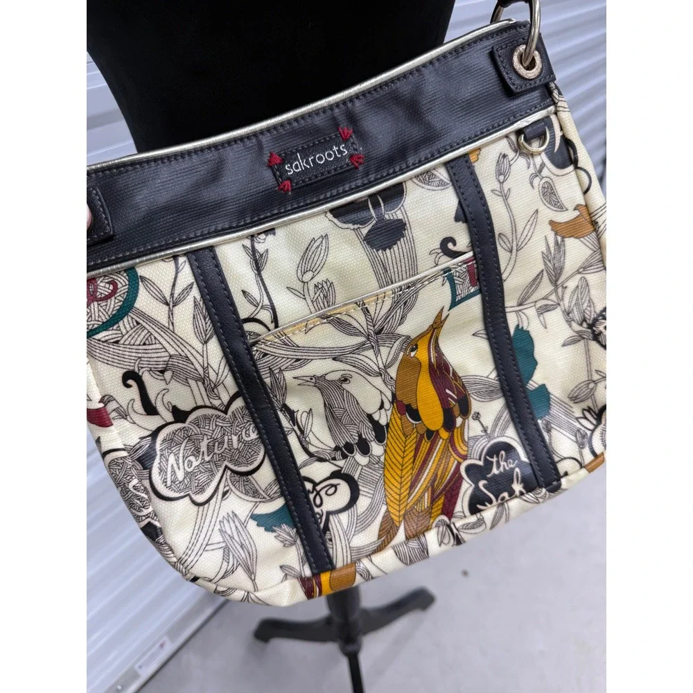 Sakroots Artist Circle Peace Print Bird Crossbody Bag Coated Canvas Cream Black